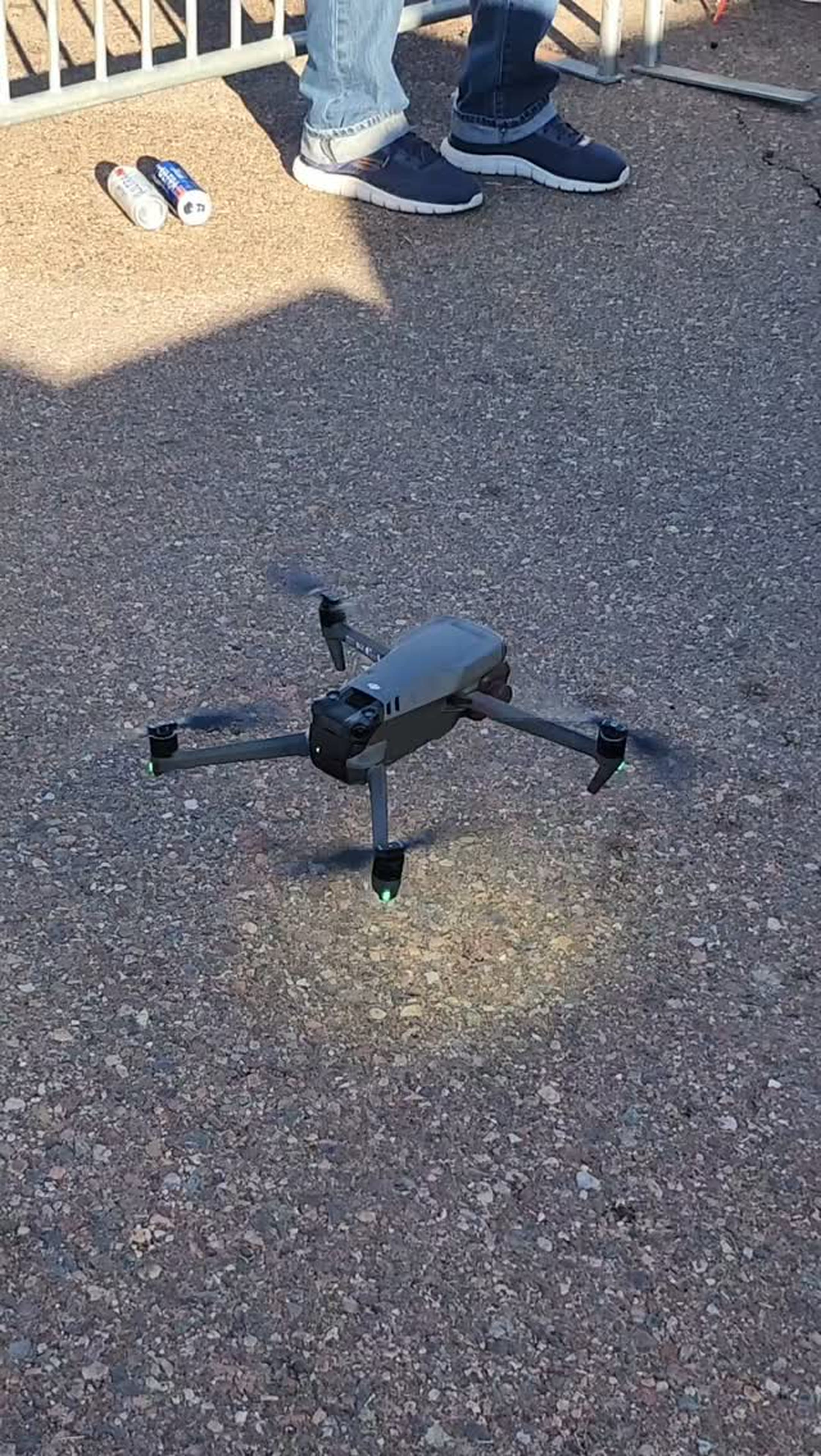 Drone hovering over asphalt