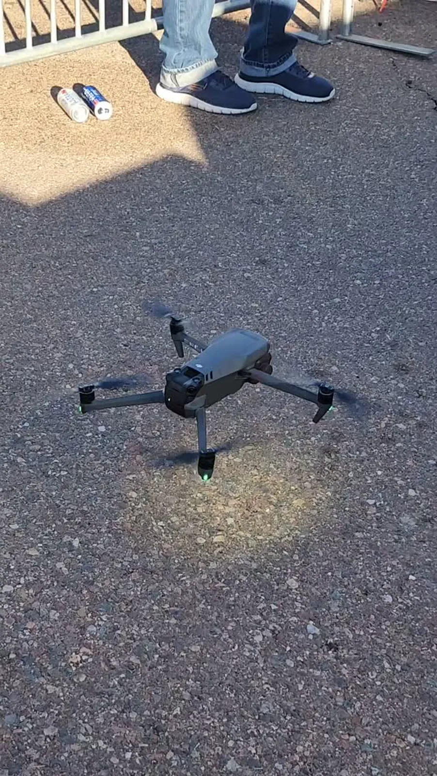 Drone hovering over asphalt